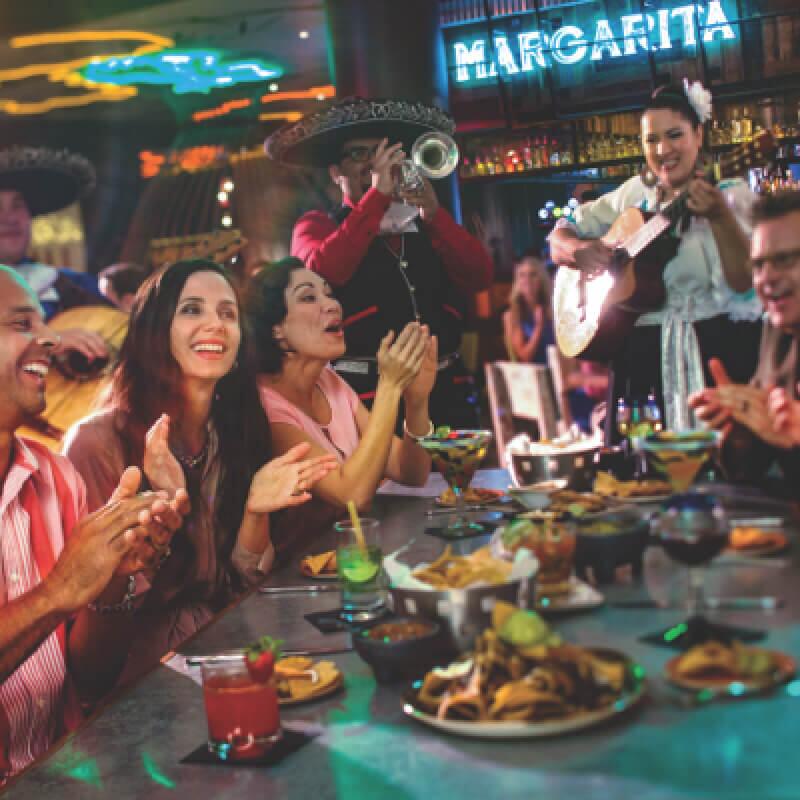 Friends dining together at Antojitos