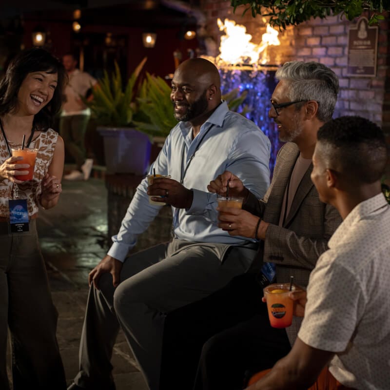Friends laughing and having drinks at Pat O'Brien's at Universal Citywalk