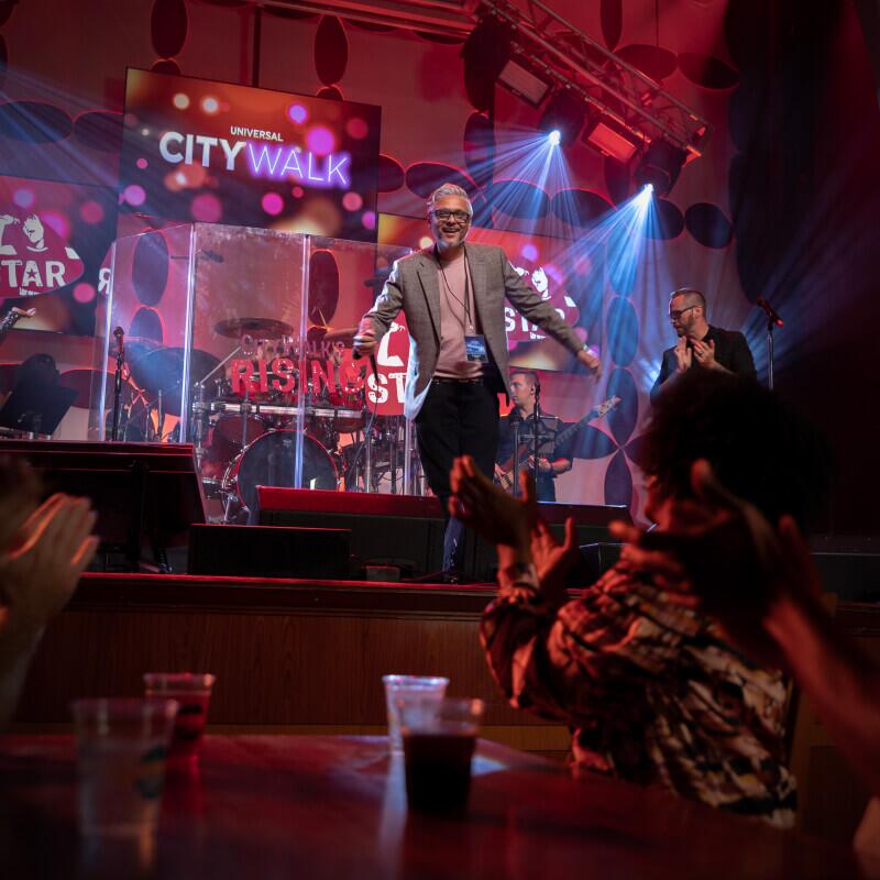 Event attendee on stage at CityWalk’s Rising Star.