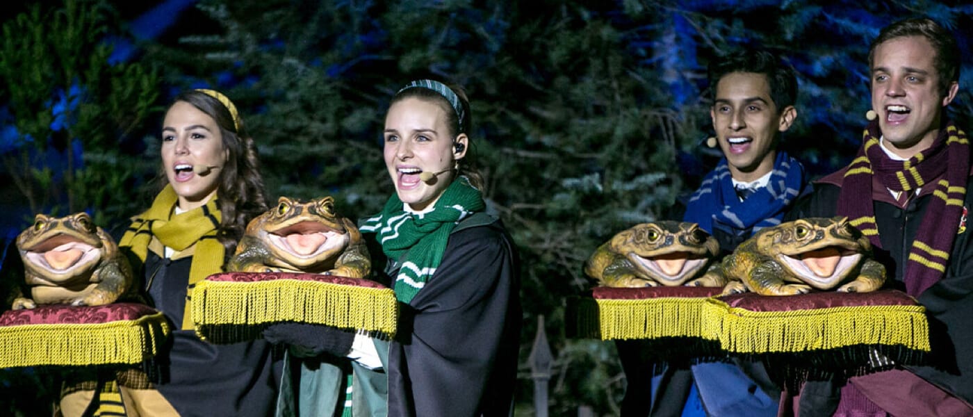Hogwarts students performing in the Frog Choir in The Wizarding World of Harry Potter Hogsmeade at Universal Islands of Adventure in Orlando.