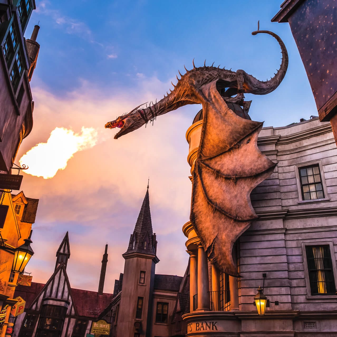 Gringotts dragon breathing fire from the top of a building