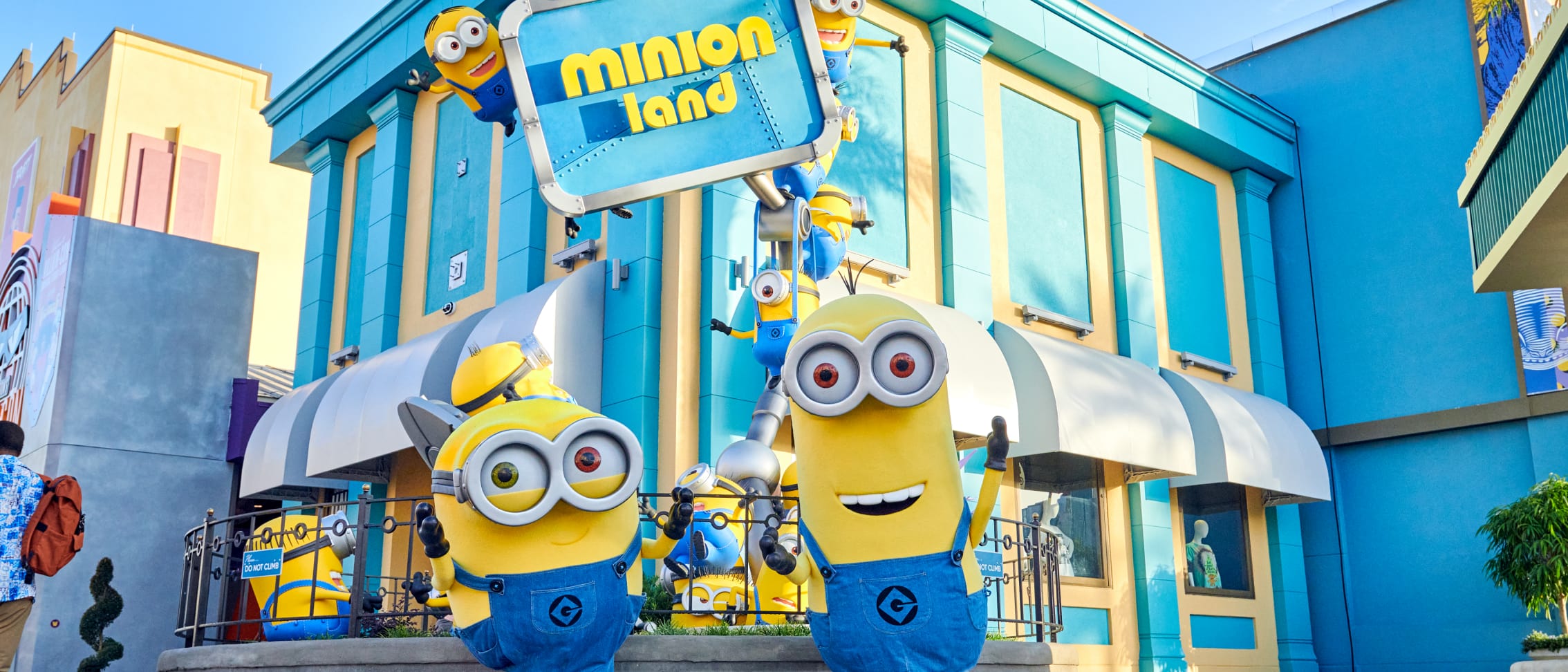Artist rendering of Minions hanging out outside of Minion Land at Universal Studios Florida