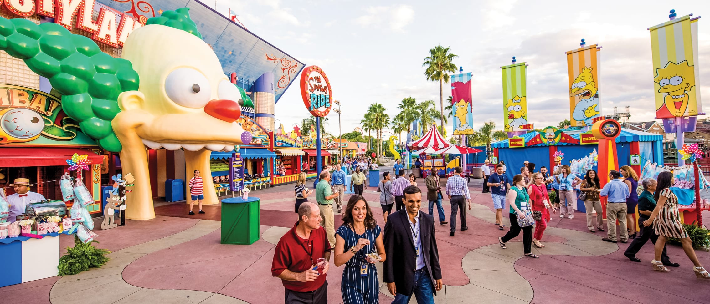 Attendees talking and walking outside of Krustyland at Universal Studios Florida