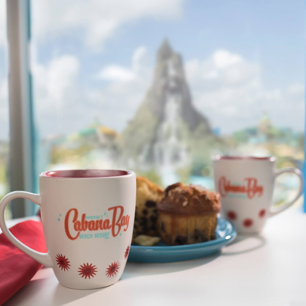 Table with coffee and breakfast on top of it