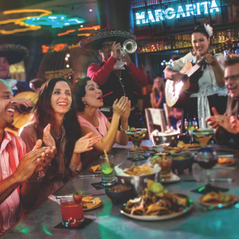 Friends dining together at Antojitos