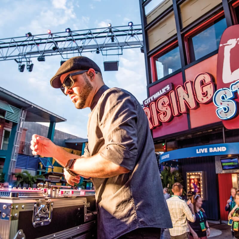 A DJ performing at a CityWalk Block Party event.