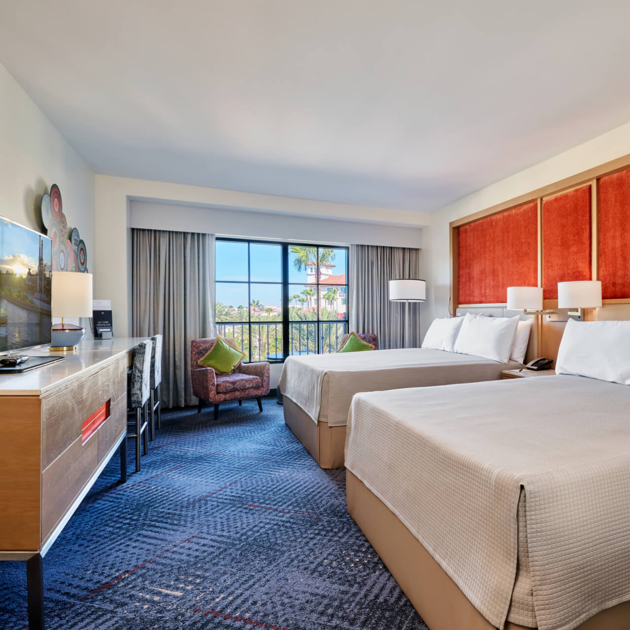 Bright and spacious guest room with two queen beds, modern furnishings, and comfortable accommodations at Hard Rock Hotel.