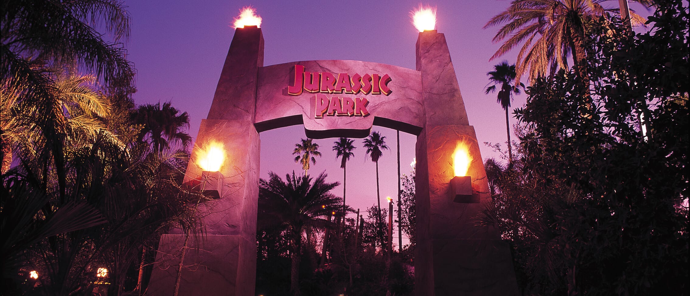 Entrance to Jurassic Park at night