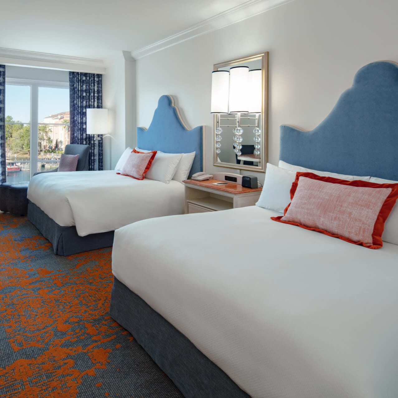 Two queensize beds in the Harborview Room at Loews Portofino Bay Hotel