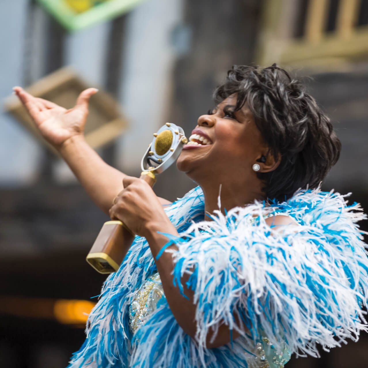 A woman singing into a microphone