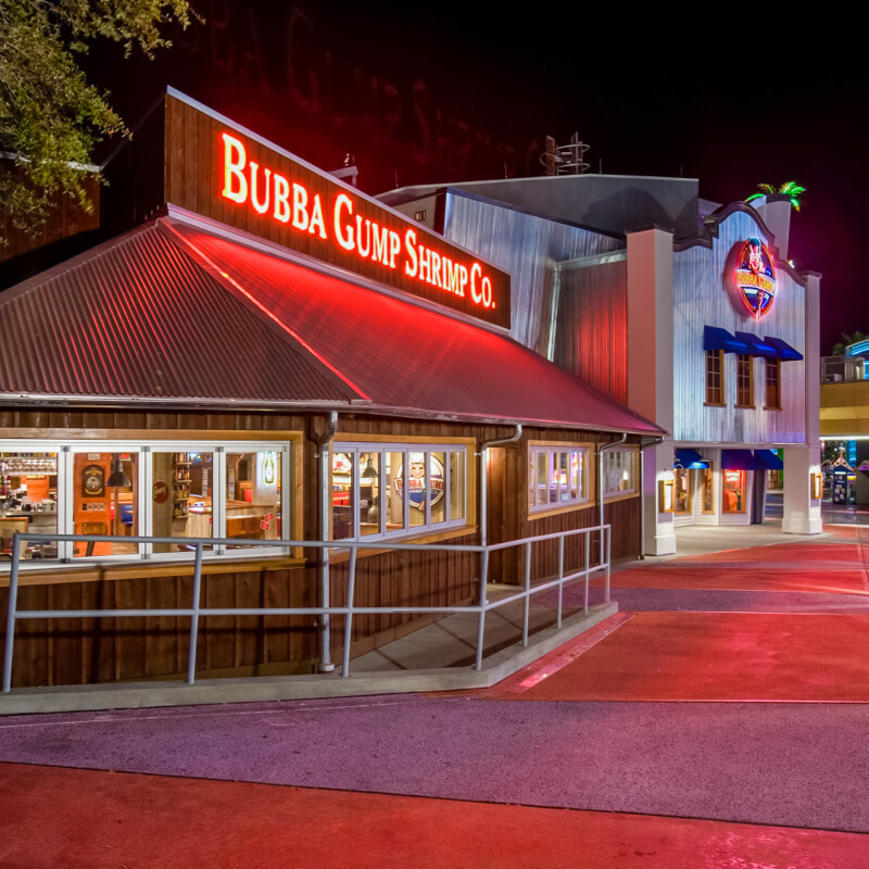 The exterior of Bubba Gump Shrimp Co. illuminated at night at Universal CityWalk Orlando.