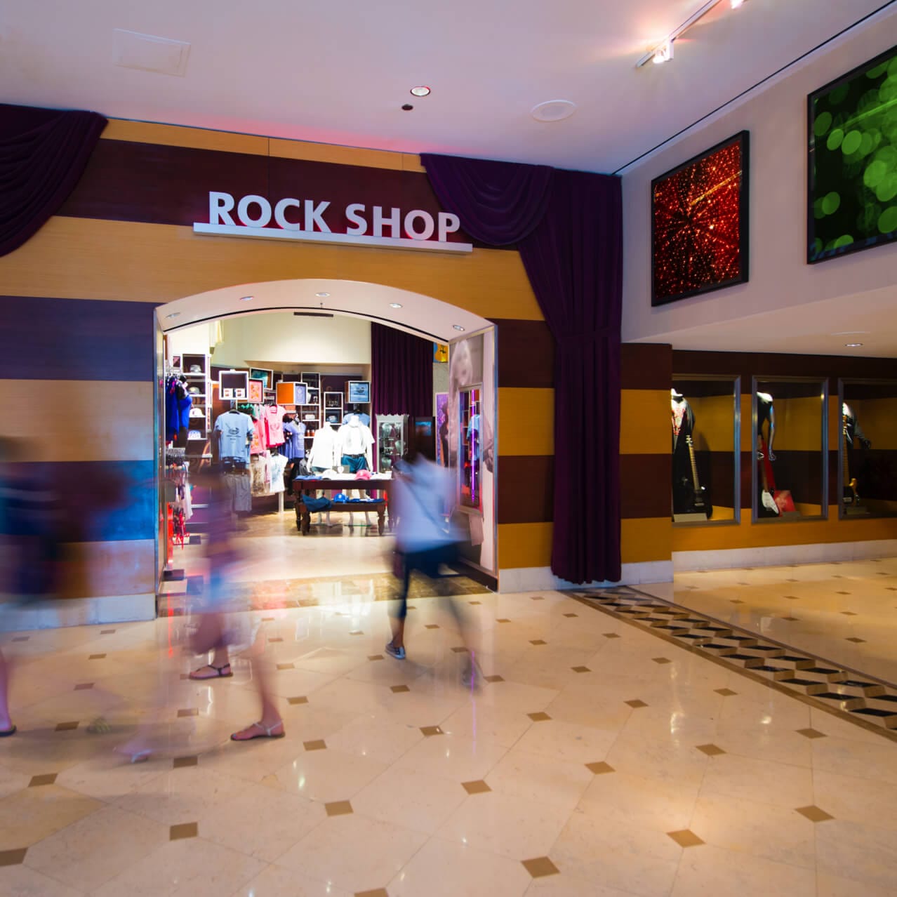 Guests pass the entrance of Rock Shop located off the lobby inside Hard Rock Hotel.