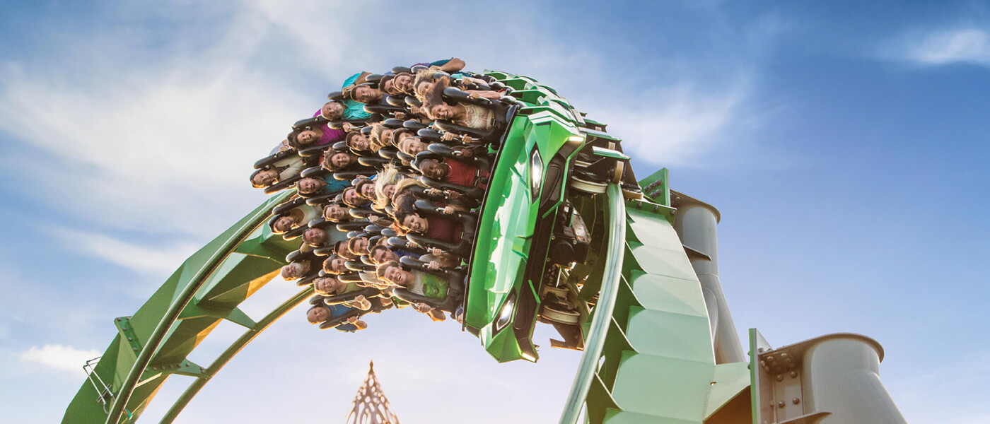 A roller coaster car barrels down the track of The Incredible Hulk Coaster at Universal's Islands of Adventure in Orlando.