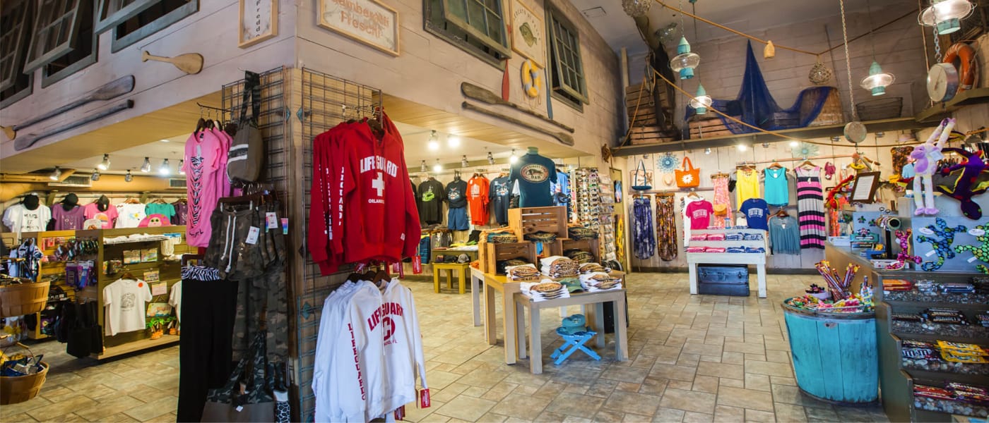 Tees, hats, sunglasses and other types of holiday wear on display inside L'Ancora at Loews Portofino Bay Hotel.