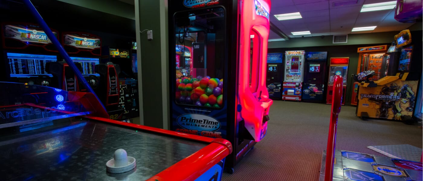 The interior of the arcade at Loews Portofino Bay Hotel at Universal Orlando, featuring air hockey, a dance game and more.