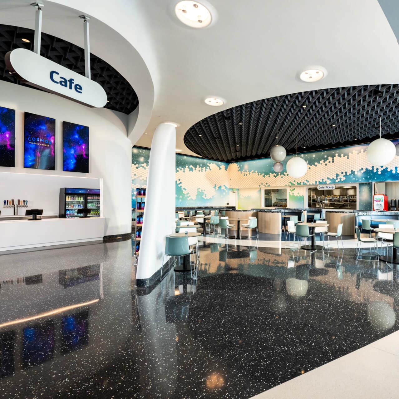 The interior lobby of the Cosmos Cafe and Market at Universal Stella Nova Resort.