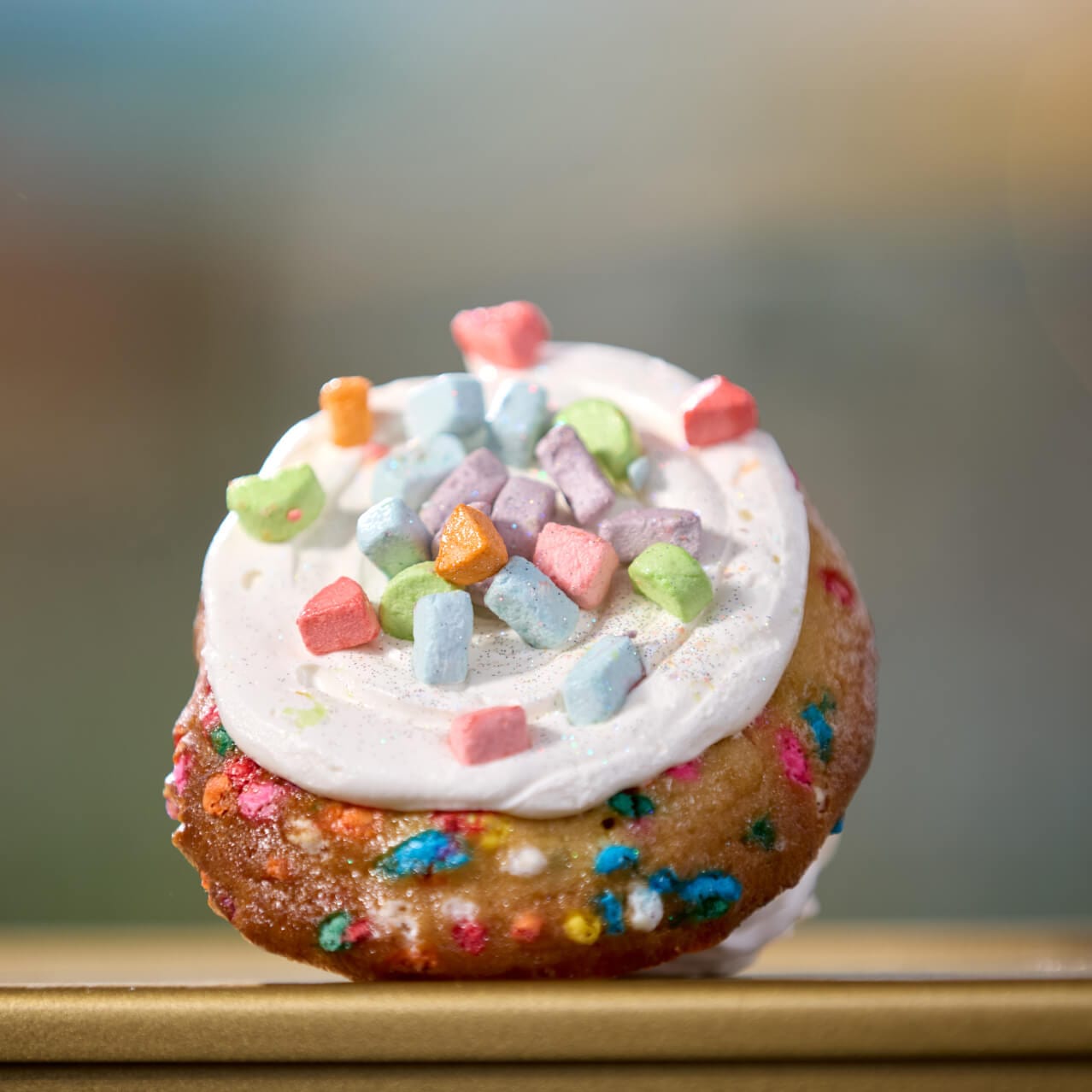 A Birthday Cookie from Frosty Moon, made up of a cookie filled with sprinkles and marshmallows and topped with buttercream and marshmallows.