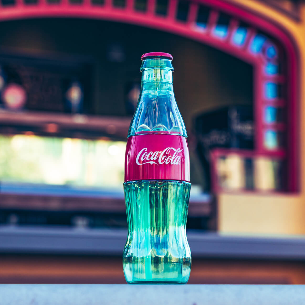 Coca-Cola Freestyle® cup in the shape of a glass bottle.
