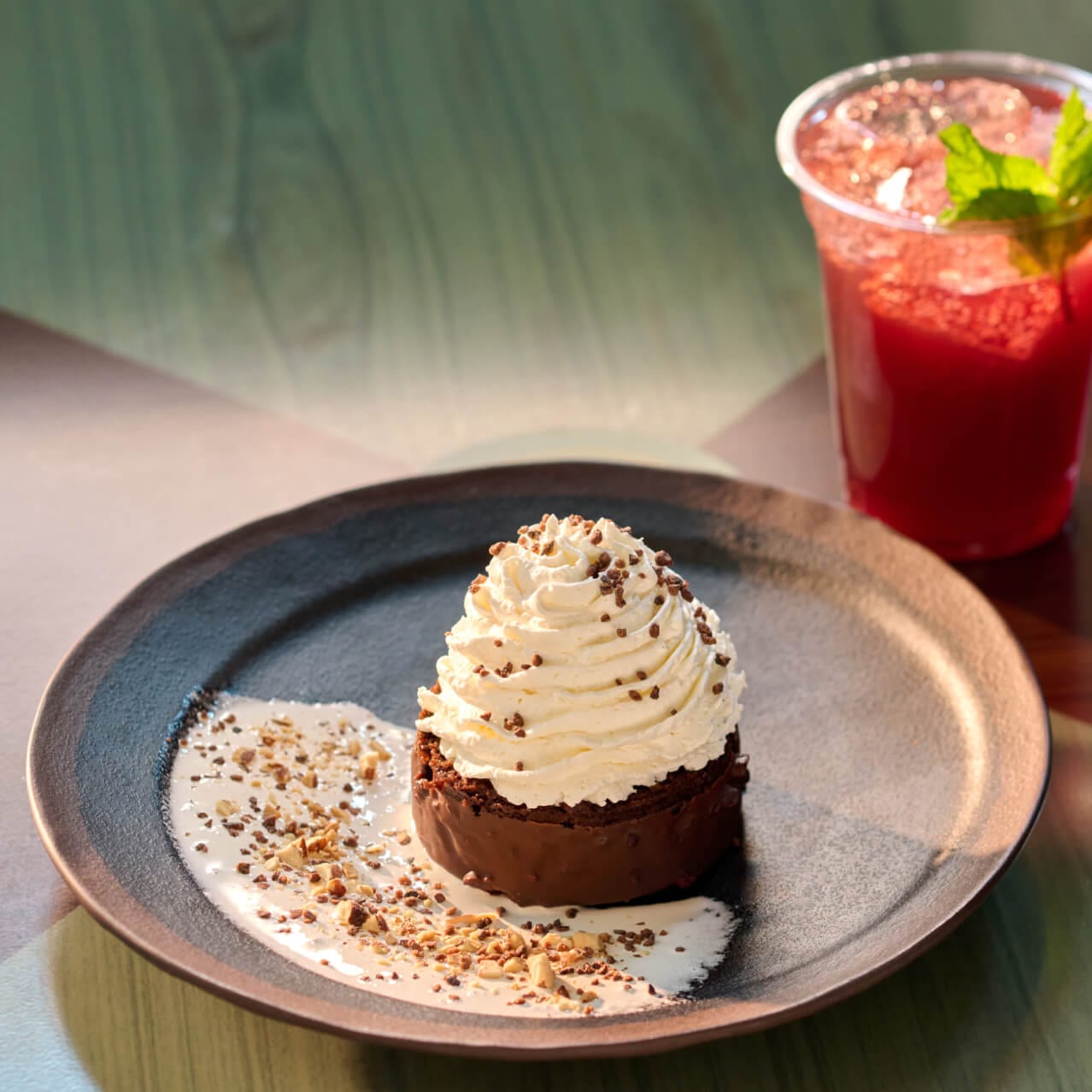 A serving of Atlas' Chocolate Cake, with marshmallow fluff, chocolate cream, with whipped topping and toasted almonds, available at Meteor Astropub