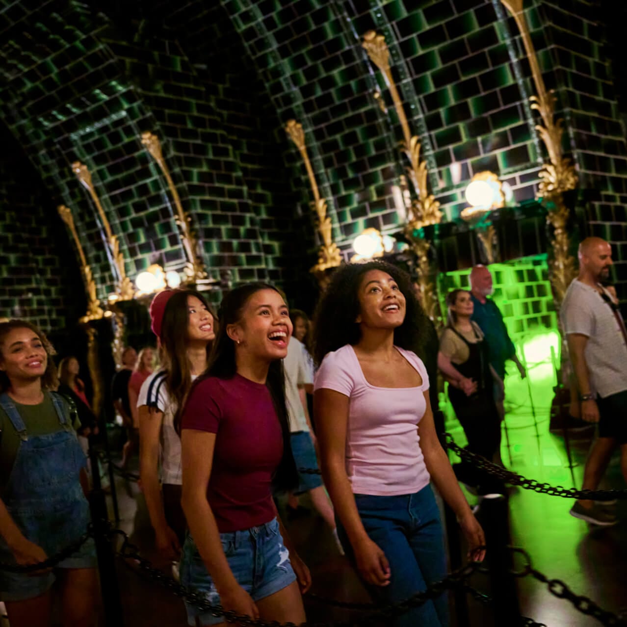 Guests gaze in wonder at their surroundings in the Harry Potter and the Battle at the Ministry™ queue.