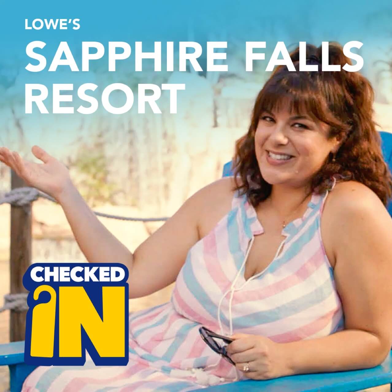 Leyla in a striped dress lounging in a chair at Loews Sapphire Falls Resort.