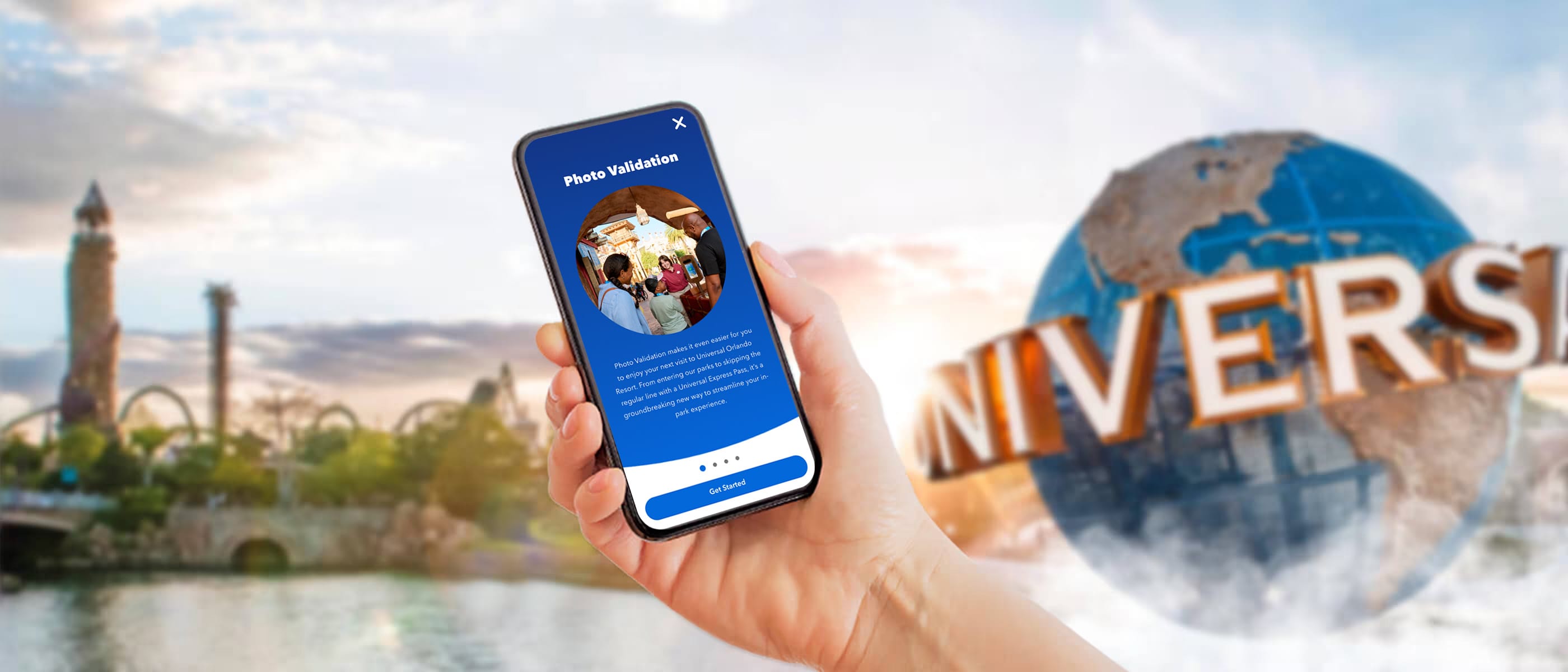 A smartphone shows the Photo Validation Mobile Enrolment onboarding screen in the Universal Studios Orlando App with the Universal Studios Globe in the background.