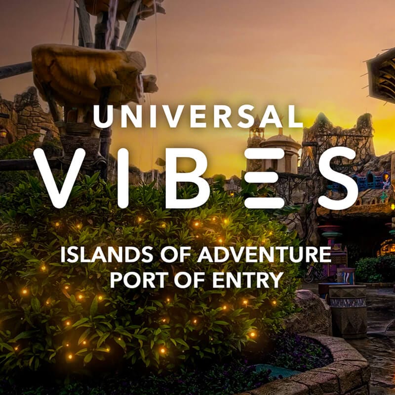 The Trading Company bathed in soft sunset light with the words "UNIVERSAL VIBES – ISLANDS OF ADVENTURE PORT OF ENTRY".