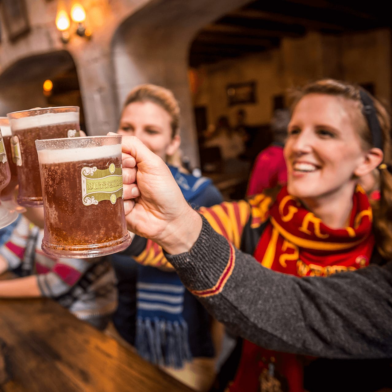 A group of friends drinking Butterbeer