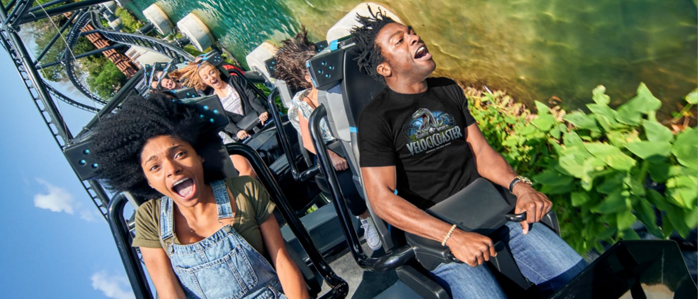 Customers riding the Velosicoaster ride and having a good time.