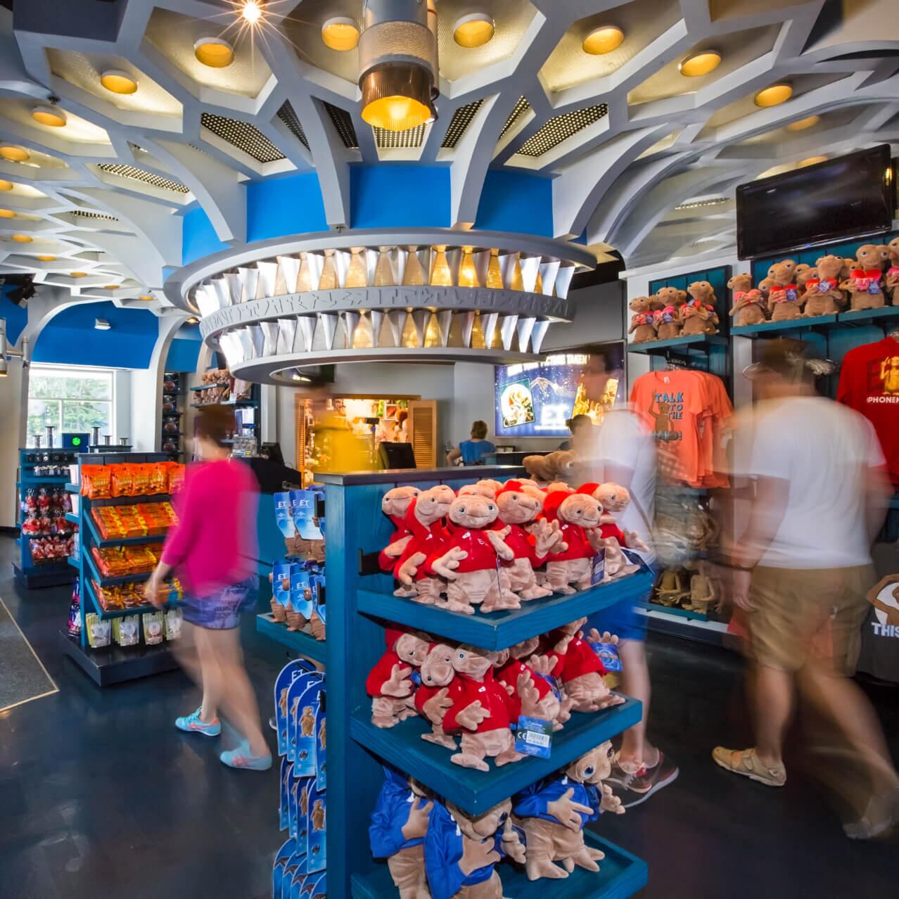 Guests peruse E.T.'s Toy Closet, a gift shop in Universal Studios Orlando filled with plush alien toys, apparel and assorted gifts.