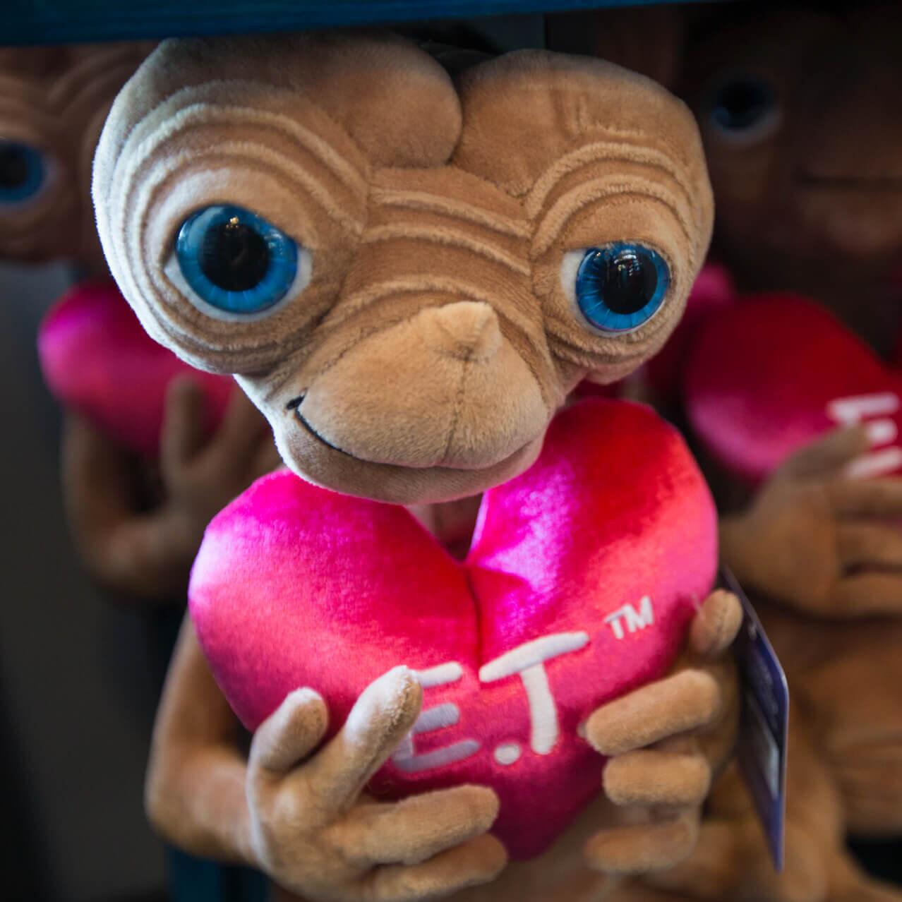 Soft E.T. plush cuddly toys on display at E.T.'s Toy Closet & Photo Spot, a gift shop in Universal Studios Orlando.