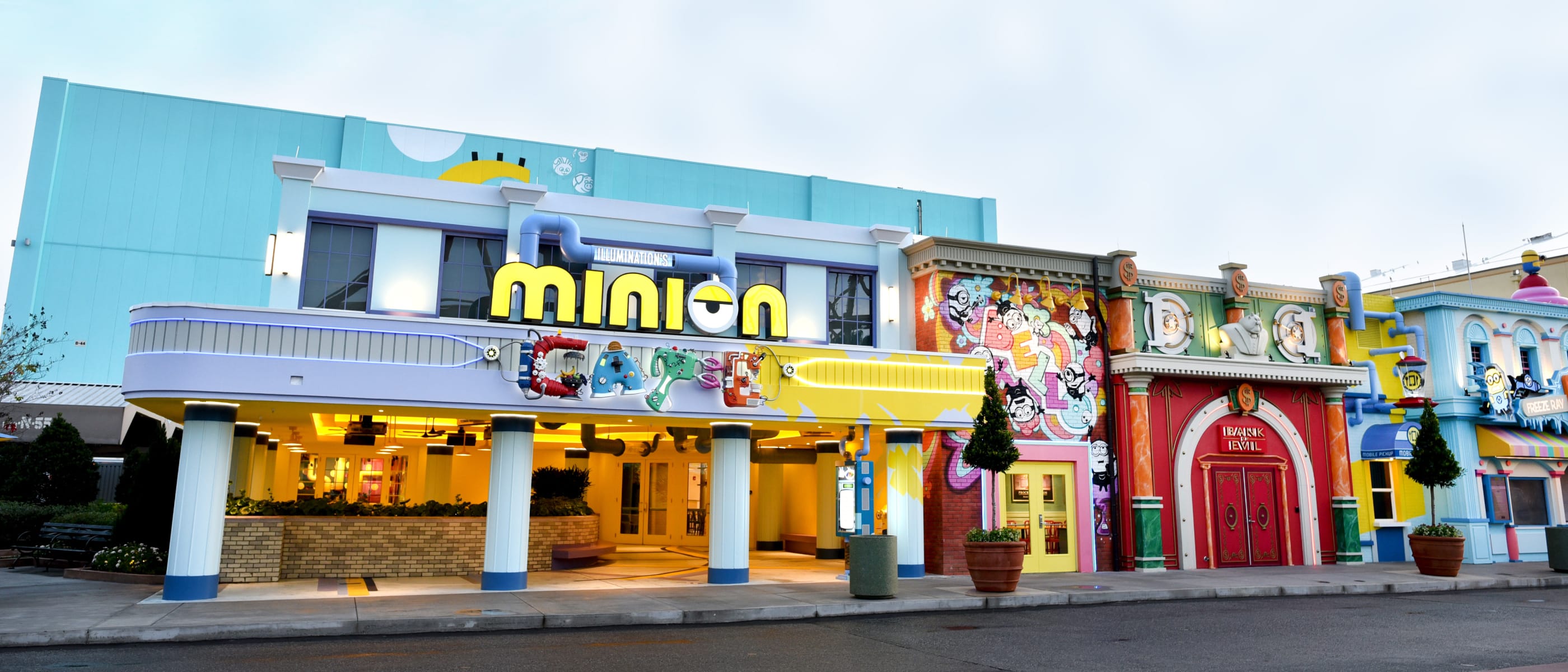 Cloudy blue skies above the front entrance of Illumination's Minion Cafe inside of Minion Land at Universal Studios Florida.