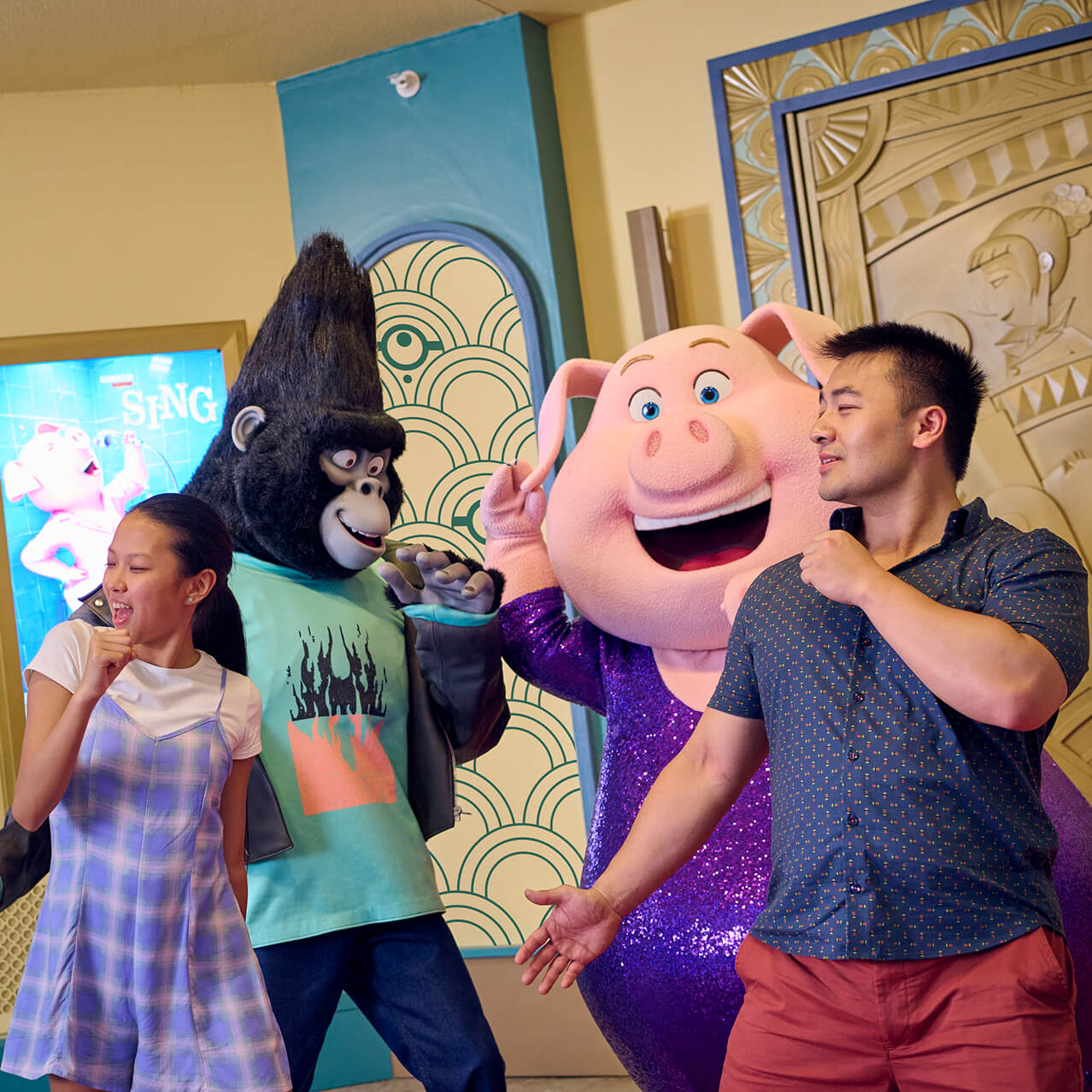 Guests posing with characters from Sing at Illumination Theater in Universal Studios Florida.