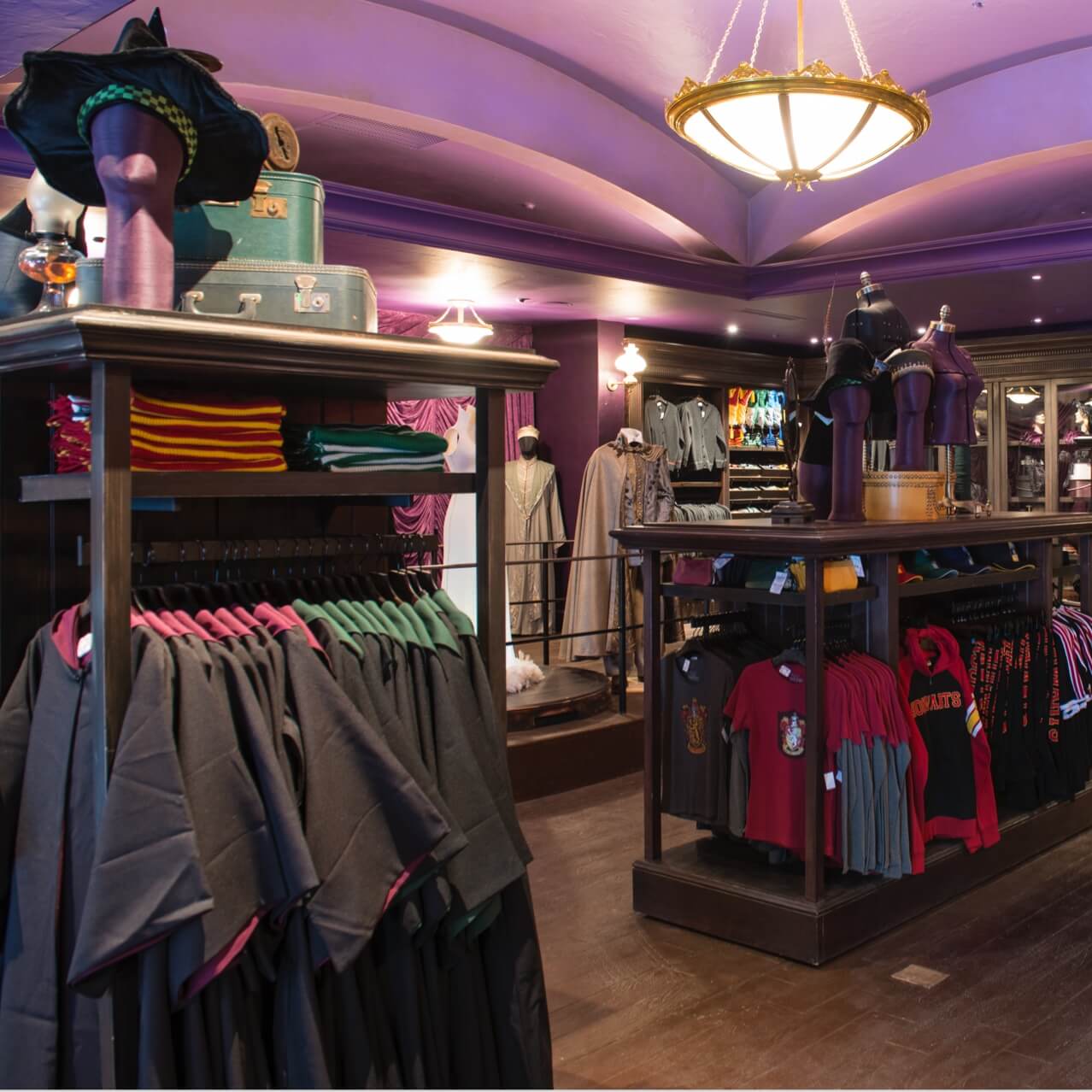 An array of Harry Potter themed uniforms, ties, scarves, and more at Madam Malkin's Robes For All Occasions at Universal Studios Orlando.