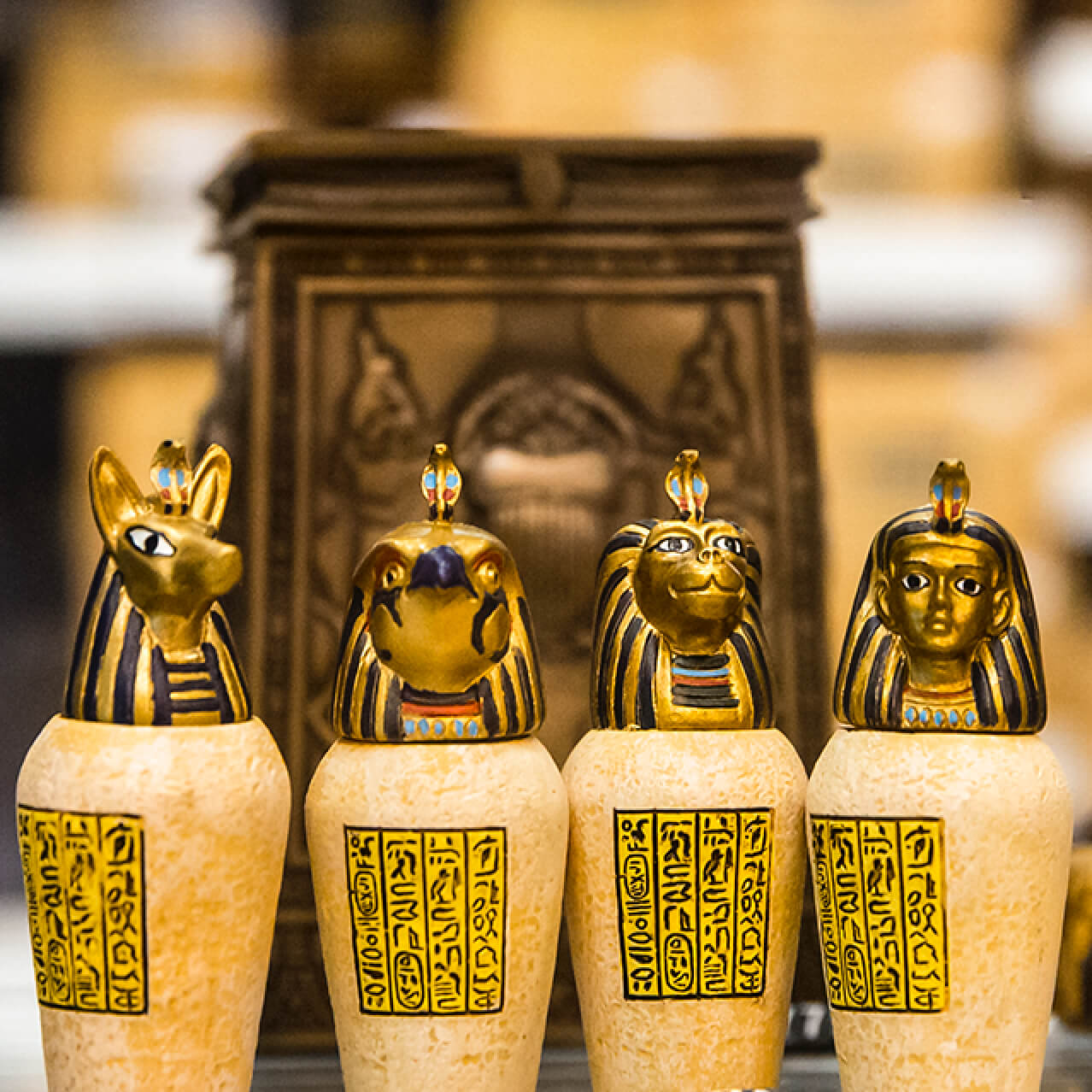 Small scale models for purchase of Egyptian mummies, statues and canopic jars on display at Sahara Traders at Universal Studios Orlando.