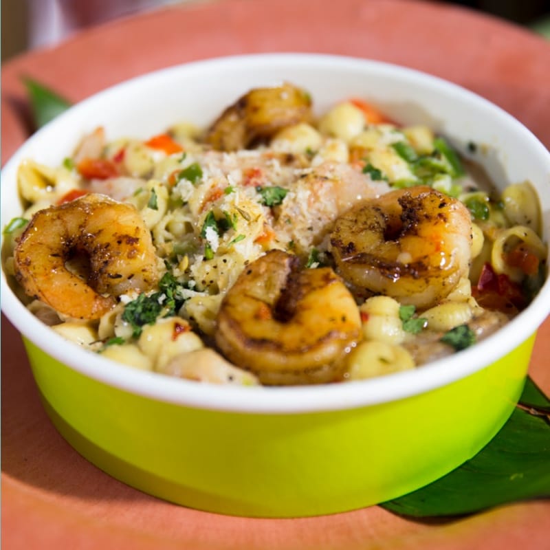 a tasty bowl of flavour from favourites like the Island BBQ Chicken Pizza, Jerk Shrimp Mac & Cheese and Tropical Baby Greens.