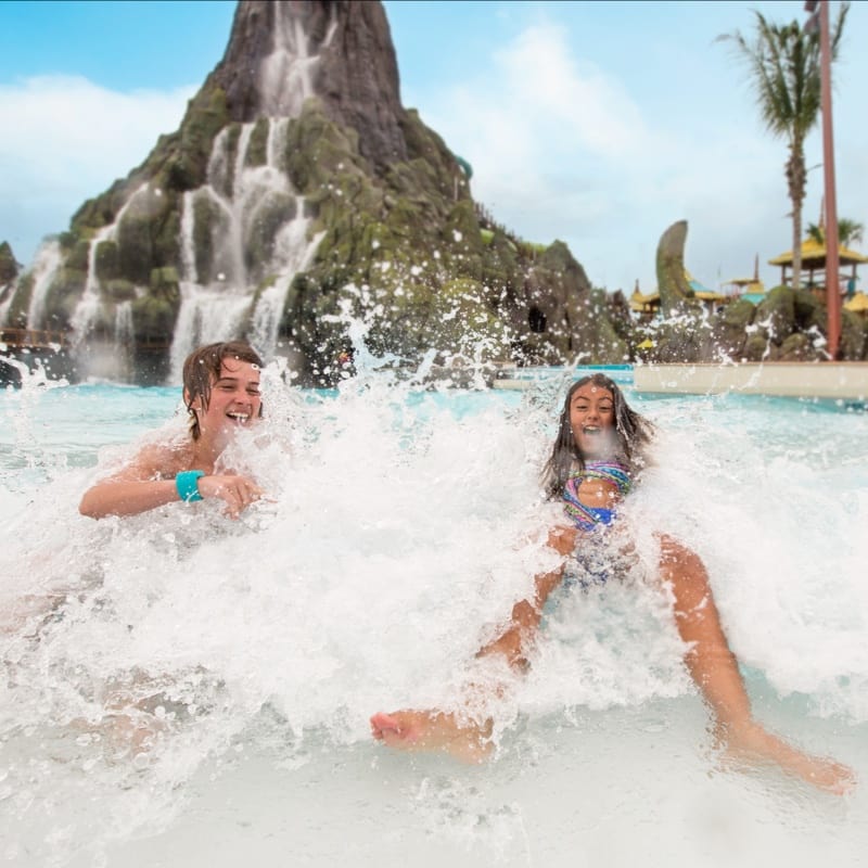 guests playing in the water at Waturi Beach in Wave Village