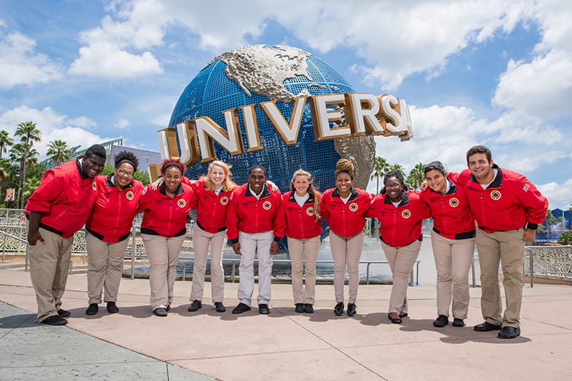 Universal Orlando education team posing in front of Universal Orlando Globe.
