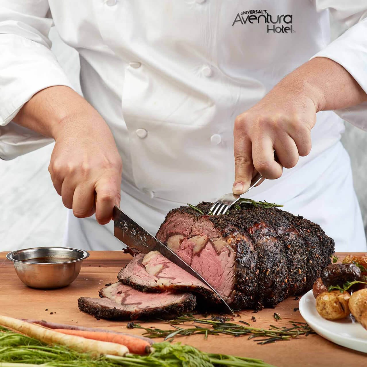 A chef from Universal's Aventura Hotel carves roast beef at the Urban Pantry food hall.