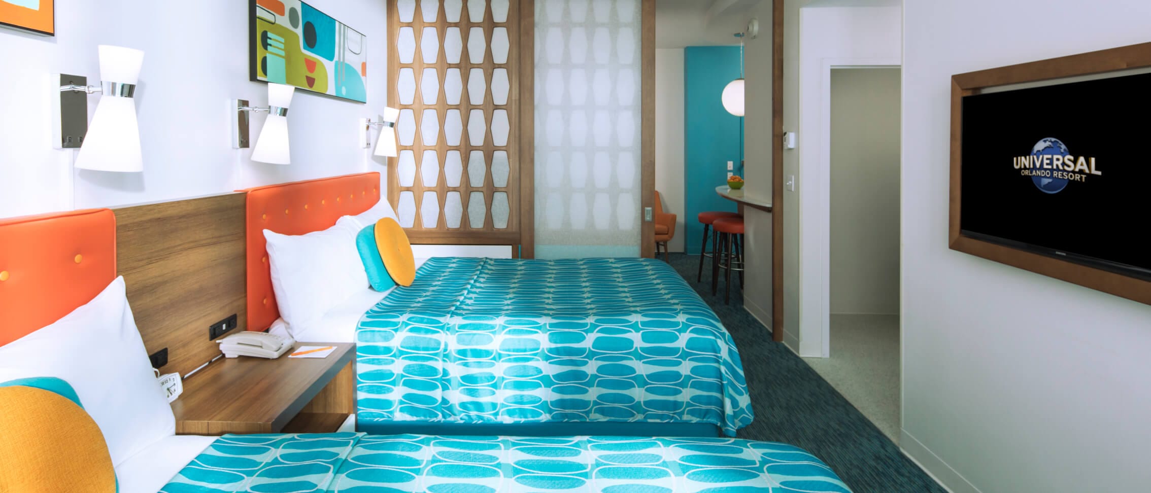 In a family suite at Universal© Cabana Bay Beach Resort, the kids hang out in one room while mom and dad relax in another.