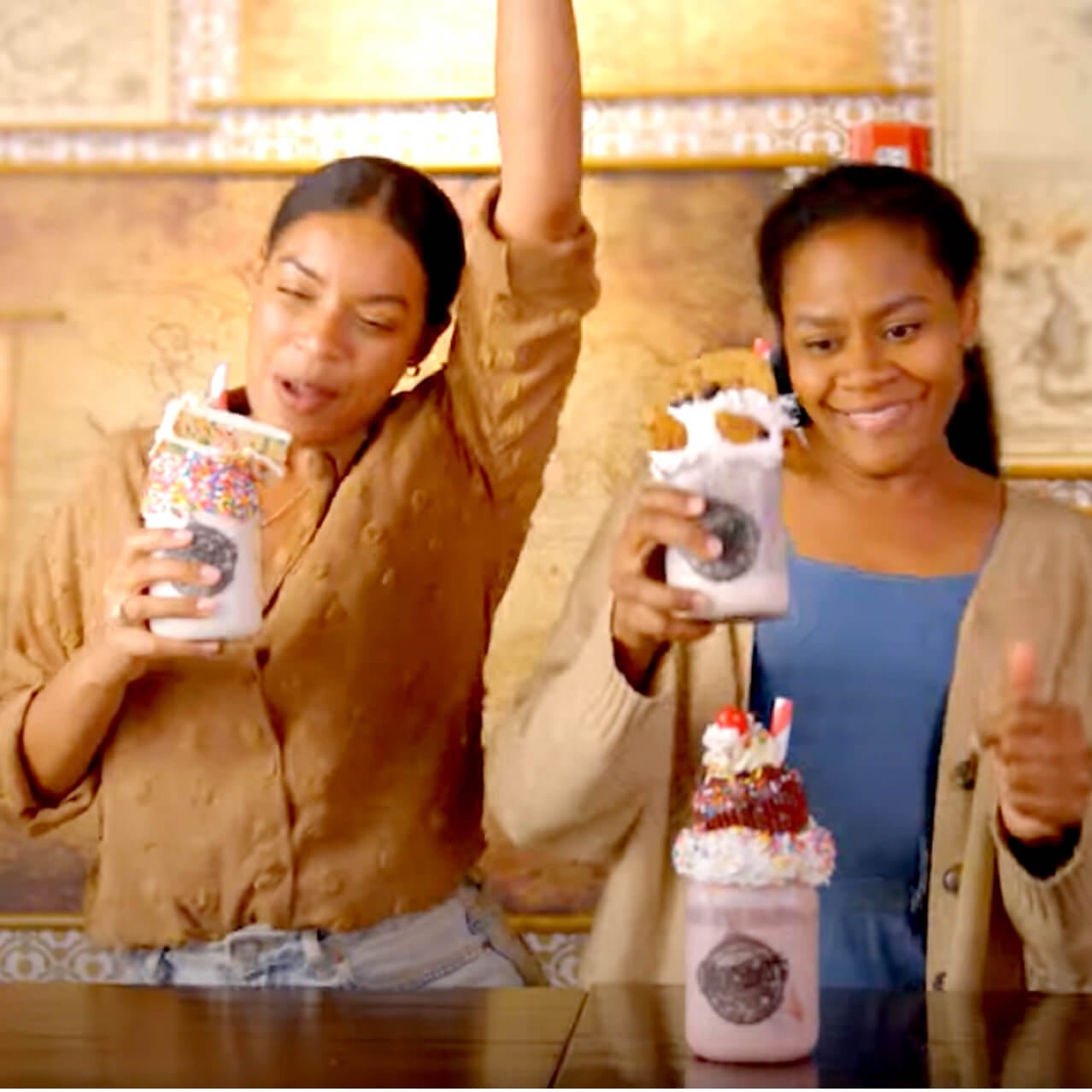 Food lovers Brandy and Nadia sample milkshakes with Penelope and Jacques at the Toothsome Chocolate Emporium and Savory Feast Kitchen at Universal CityWalk in