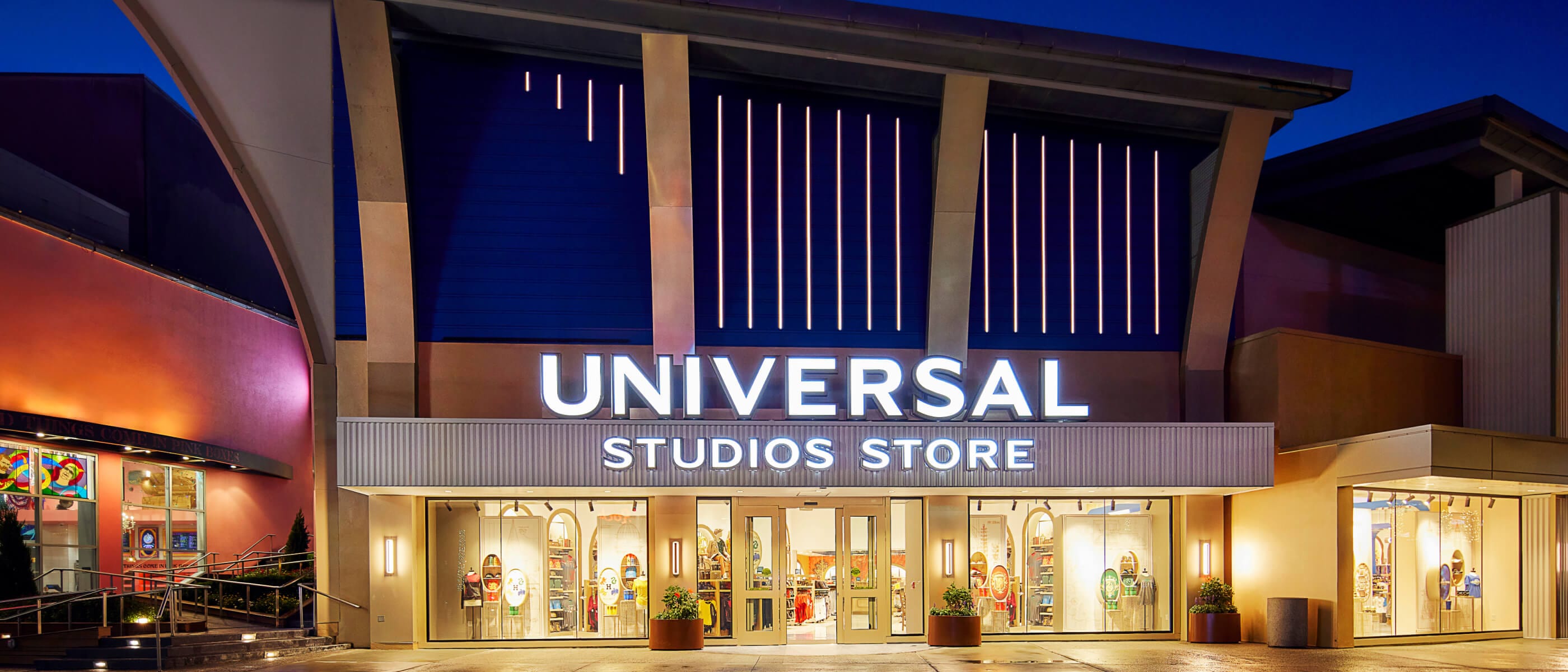 A nighttime view of the exterior of the Universal Studios Store at Universal CityWalk.