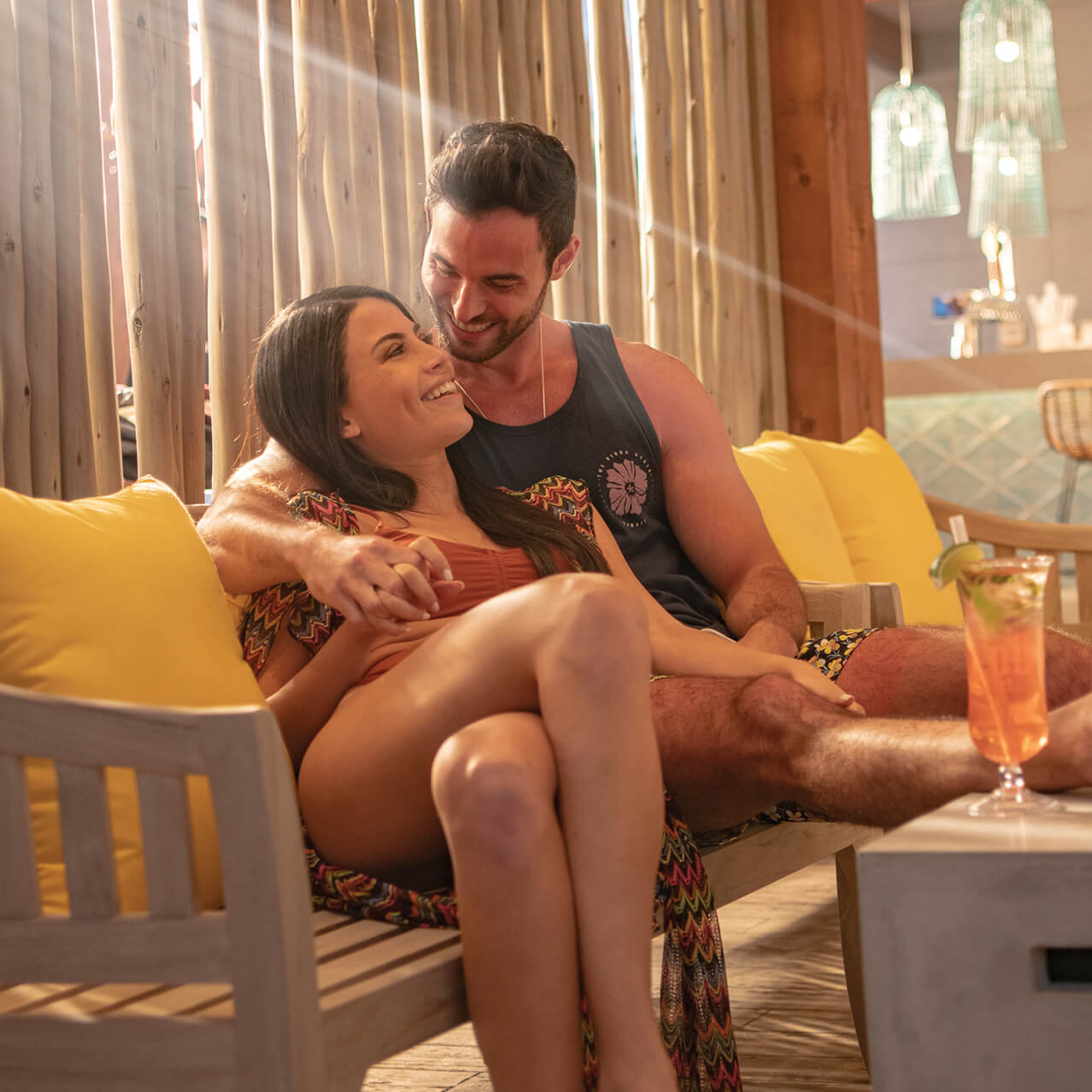 A couple enjoy some downtime at Oasis Beach Bar, the poolside bar of  Universal Endless Summer Resort - Dockside Inn and Suites.