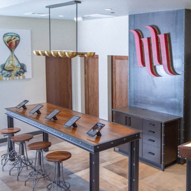 A table and barstools at Hart & Huntington Tattoo Company at Universal Orlando.