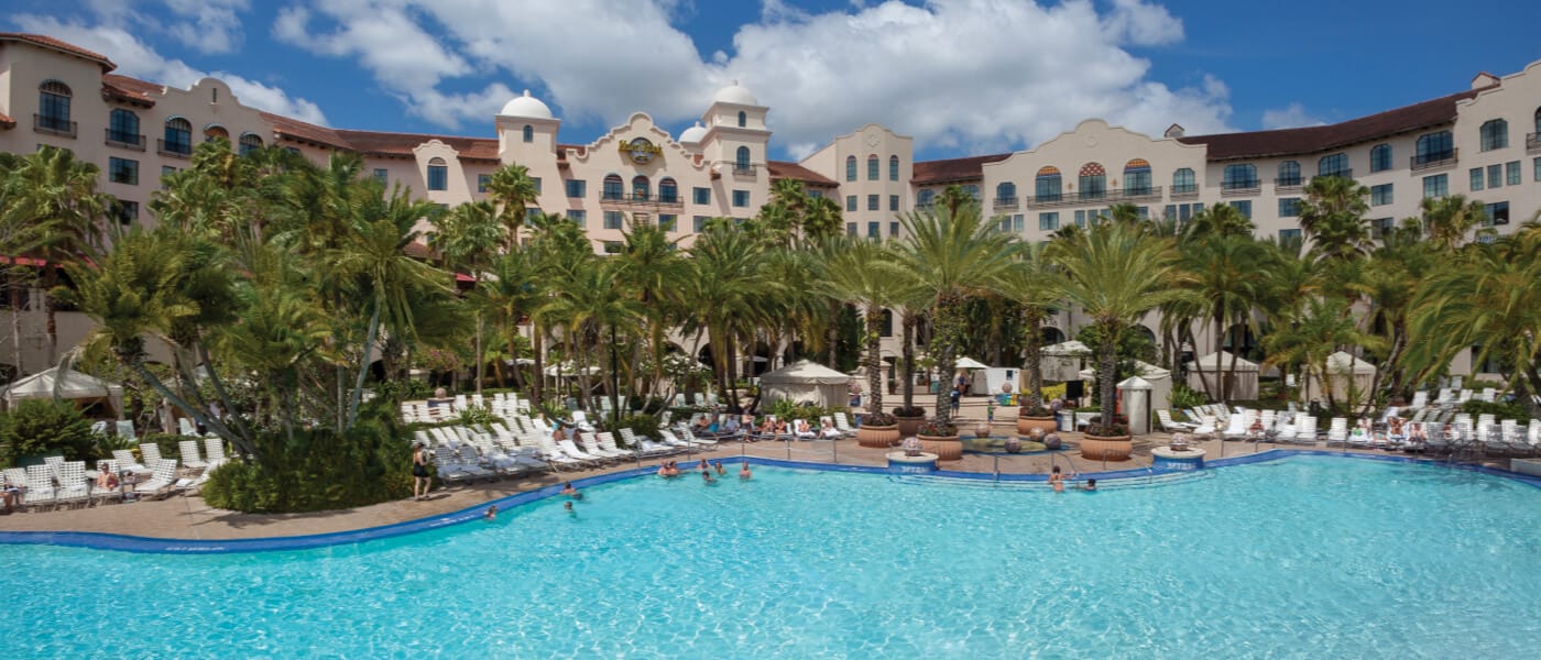 Guests enjoy the glistening pool at Hard Rock Hotel, one of the Premier on site resort hotels at Universal Orlando.