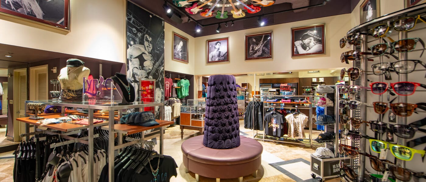 The interior of Rock Shop, a souvenir store at Hard Rock Hotel in Universal Orlando that is decorated with a guitar chandelier and images of music legends.