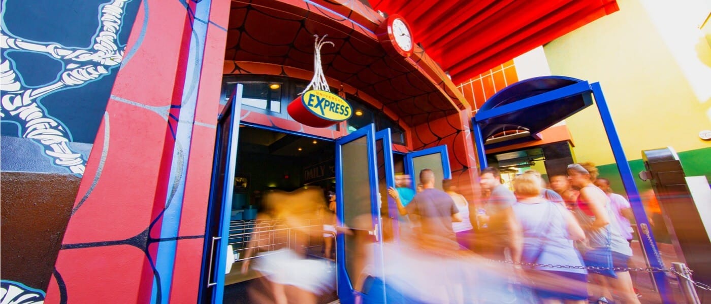 A blur of people rush toward an Express ride entrance at Universal Orlando Resort.