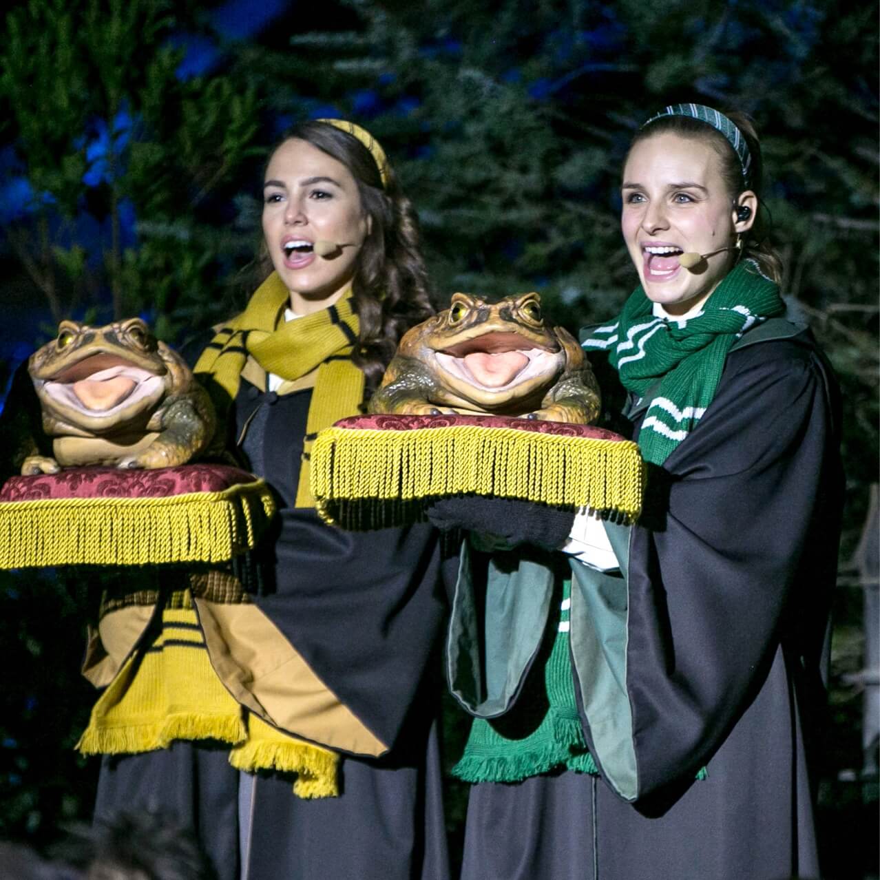 Frog Choir singers hold their musical frogs look during a live show at The Wizarding World of Harry Potter – Hogsmeade™, at Universal's Islands of Adventure in Orlando.
