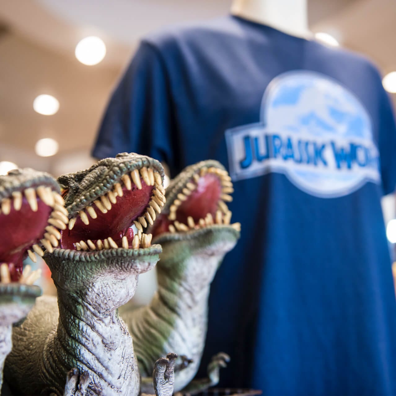 Dinosaur stuffed animals and a T shirt on display at Dinostore, a Jurassic Park themed souvenir shop at Universal's Islands of Adventure in Orlando.