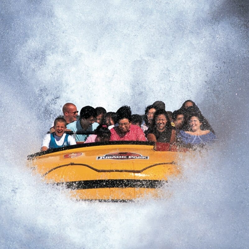 Guests splash down on Jurassic Park River Adventure at Universal Islands of Adventure.